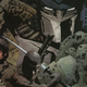 Optimus Prime looms behind Snake Eyes in his ninja gear, as well as Duke and Roadblock in WWII uniforms.